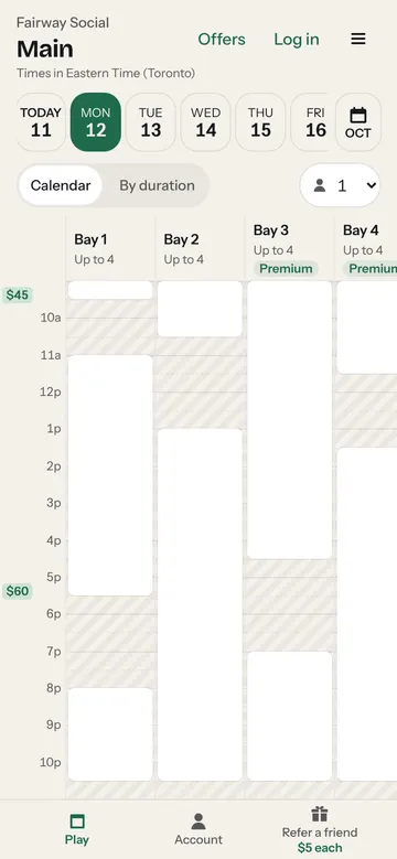 The booking calendar on a phone: bays as columns, taken times shaded, peak prices marked beside the hours.